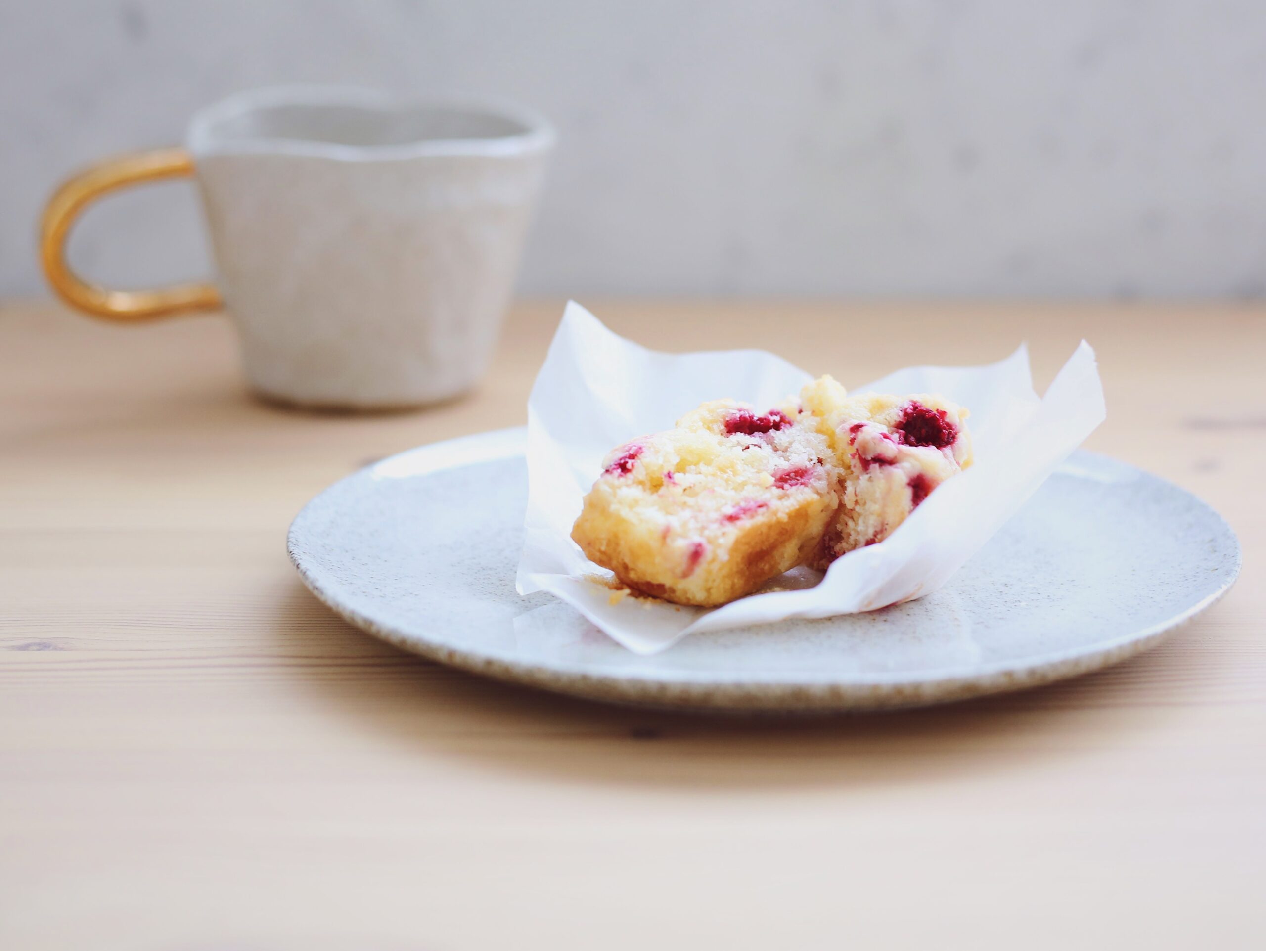Photo of raspberry and white chocolate muffin